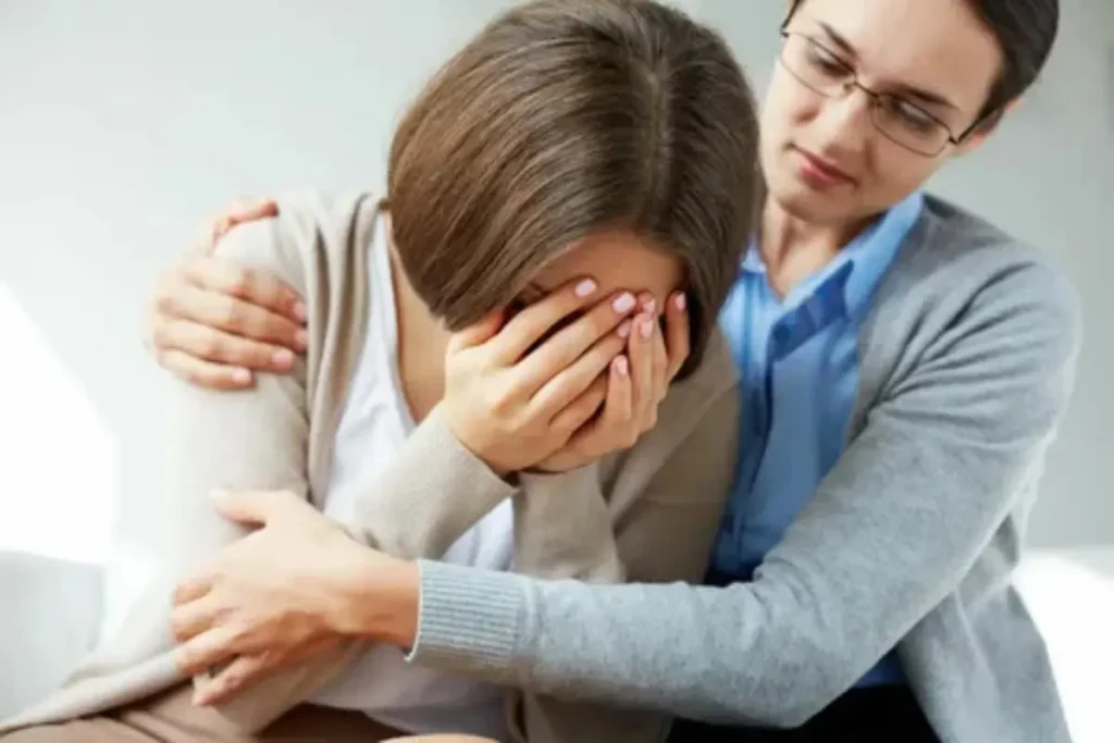 Mulher chorando numa sessão de psicoterapia